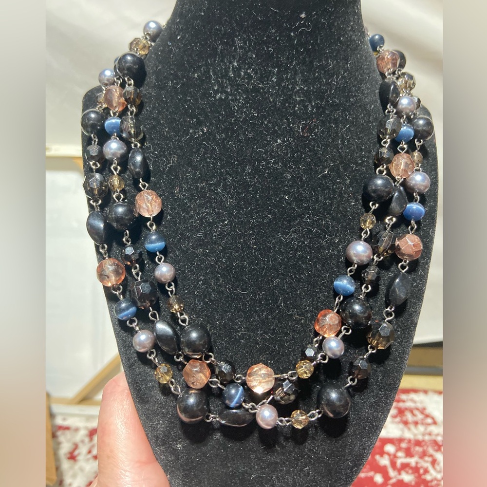 Multiple Styles of Beaded Necklace With Silver Tone Links.